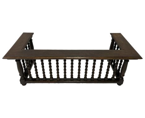 Late 19th century oak fire fender, the moulded rectangular top on a balustrade of bobbin turned supports, moulded lower rail,