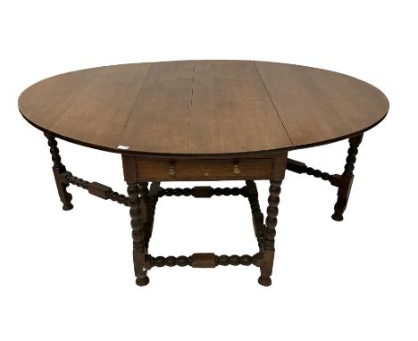 19th century oak drop leaf dining table, oval top fitted with single drawer to each side, bobbin turned gate leg supports uni