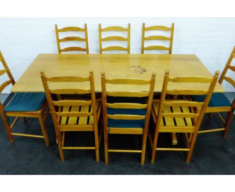 Ercol dining suite comprising a pine table and set of eight ladder-back chairs, 74 x 184cm (9)