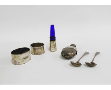 A mixed lot to include a miniature Chester silver mounted hip flask, circa 1910 together with two silver napkin rings, silver