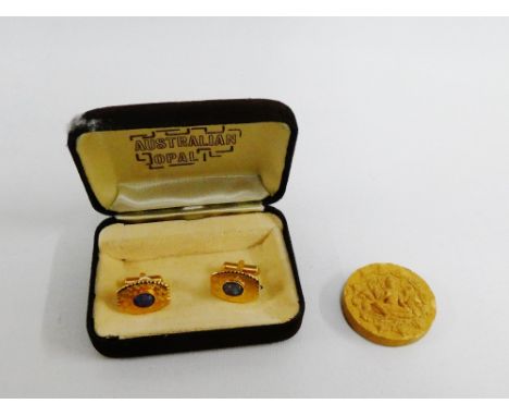 Pair of Australian opal and gilt metal cufflinks, together with a good fortune temple amulet