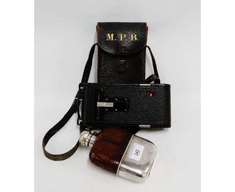 Silver plated and leather mounted hip flask, together with an early 20th century Kodak camera with a case, (2) 