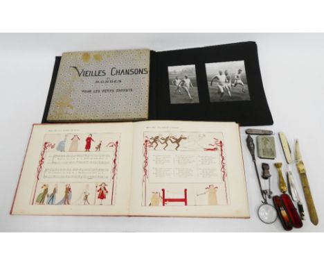 Silver mounted and amber cheroot in a leather case, a Robert Burns vesta, a bone handled paper knife, silver penknife, brass 