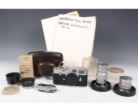 A Leica M2 camera, No. 961400, circa 1959, with leather case, together with a Leitz Elmar 1:4/90 lens, cased, a Summicron f=5