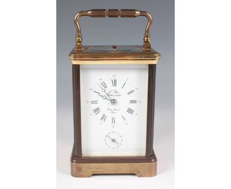 A late 20th century French lacquered brass corniche cased carriage alarm clock by L'Epée, with eight day movement striking an