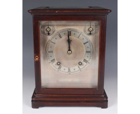 An early 20th century mahogany mantel clock with eight day movement striking on two gongs, the backplate stamped 'W&amp;H Sch