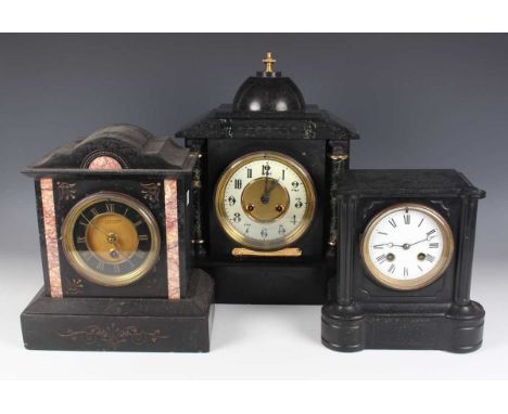 An early 20th century slate mantel clock with eight day movement striking on a gong, height 36cm, together with another slate