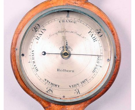 An early 19th century mahogany wheel barometer with silvered dial, inscribed 'Lione &amp; Somalvico 14 Brook St Holborn', hyg