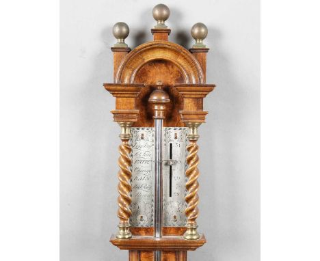 A 20th century Queen Anne style walnut stick barometer with arched surmount, ball finials, barley twist columns and turned ci