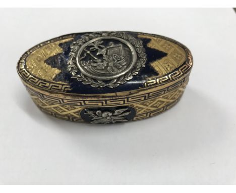 A 19th century oval gilt metal and enamel box silver mounted with classic decoration