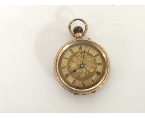 A 9carat gold button wind watch seen working diameter 3.5cm.