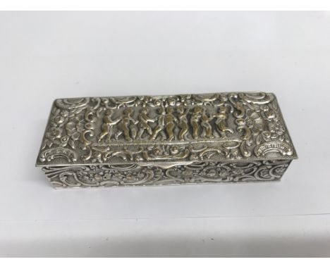 A continental white metal trinket box depicting cherubs
