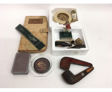 A small group of odds including a silver mounted Meersham pipe, a Johnnie Walker advertising figure and Canberra related item