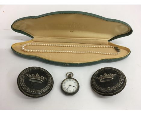 A lady's silver pocket watch, silver clasp pearl necklace and two large button with white metal decoration