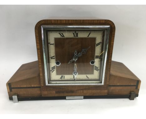 An Art Deco design mantle clock plus one others.