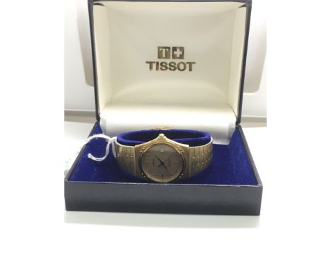 A gent's, boxed Tissot Seastar watch with gold colour bracelet strap
