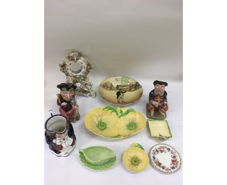 A Victorian porcelain clock face, Toby jugs and Carltonware ceramics