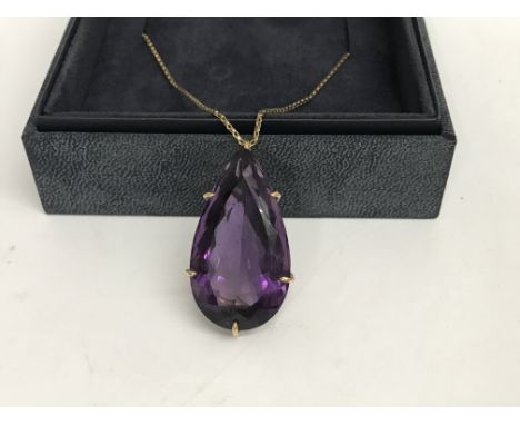 A 9 ct mounted pear cut amethyst pendant on chain