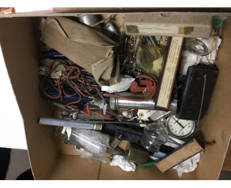 A box containing medical equipment a black cased instrument and a mahogany case containing a microscope.