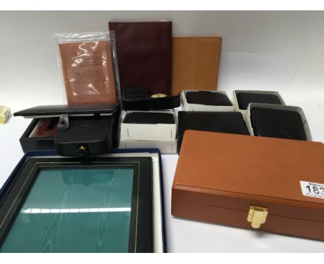 A collection of English leather goods including a Swaine Adeney trinket box passport holder small wallets traveling clocks an