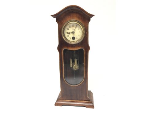 A Small desk top longcase clock with visible weights and pendulum. Height 26cm.