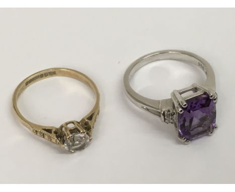 A 9ct gold solitaire ring and a silver and amethyst set dress ring.Approx K/L and L/M