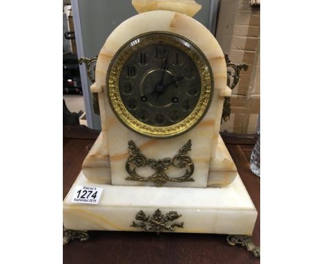 A French mantle with applied brass mounts  clock the circular dial with Roman numerals