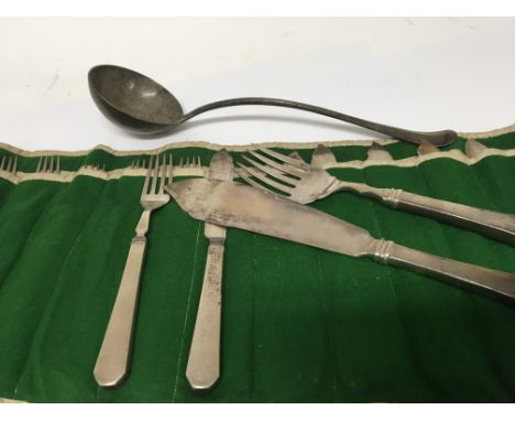 A large silver ladle and a sterling silver fish knife and folk set  and matching fish servers.