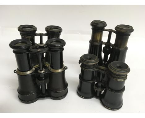 Four pairs of vintage binoculars including one pair with a compass
