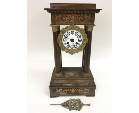 An inlaid Portico clock with enamel Roman Numeral dial and pendulum.Approx23x13x42cm