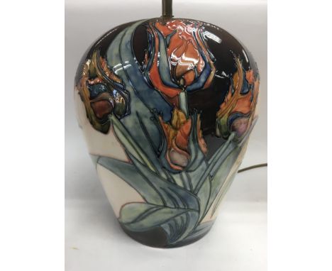A Moorcroft red tulip lamp, approx total height 42cm.