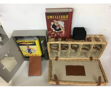 A group of Breitling Watch collectibles comprising a boxed tin set and one other, picnic hamper and watch case