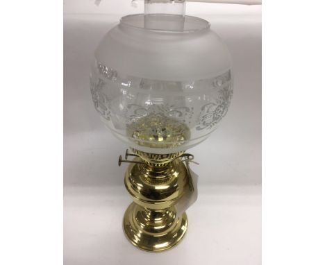 A modern brass oil lamp in original retail box.