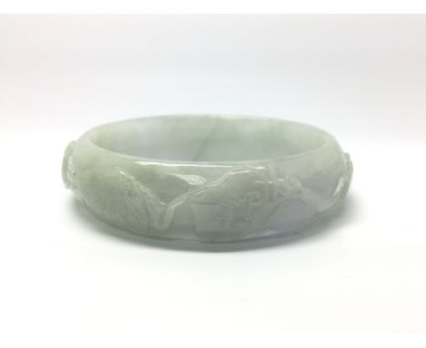 A hardstone bangle decorated with animals and creatures, weight approx 64.7 grams - NO RESERVE