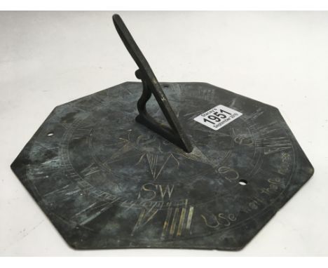 An 18th Century style octagonal sundial with Gnomon engraved with sun and engraved with the Motto “Use Well These Hours”