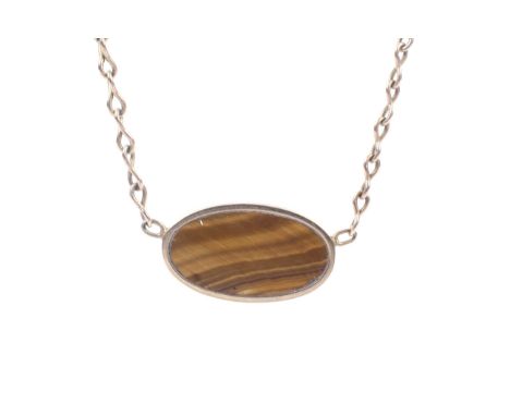 A vintage Italian 9ct gold and tigers eye necklace. The frontispiece spectacle set with an oval tigers eye panel, on a belche