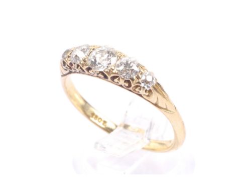 An early 20th century gold and diamond five stone carved half-hoop ring. The graduated old-cut stones approx. 0.95cts total, 