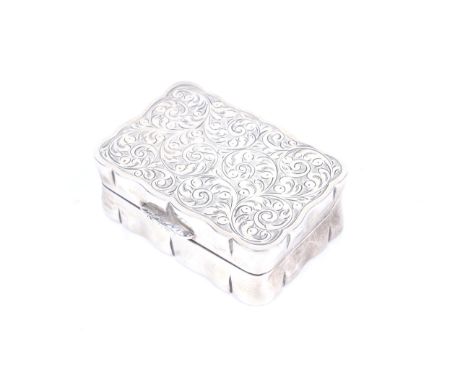 A vintage silver shaped-rectangular snuff box. The hinged lid engraved with foliate scrolls, mark of Charles S Green & Co. Lt