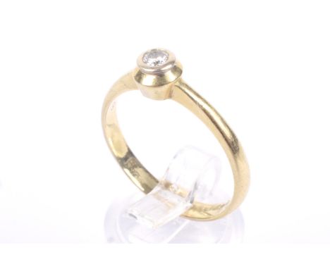 A vintage Continental diamond solitaire ring. The round brilliant approx. 0.12cts, rub-over set between knife-edge shoulders 