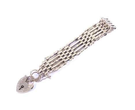 A vintage 9ct gold five bar and block gate bracelet. On a heart-shaped padlock clasp, hallmarks for London 1972, 20.6g