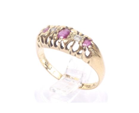 An early 20th century 18ct gold, ruby and diamond five stone ring. The three oval, cushion-cut and rectangular rubies spaced 