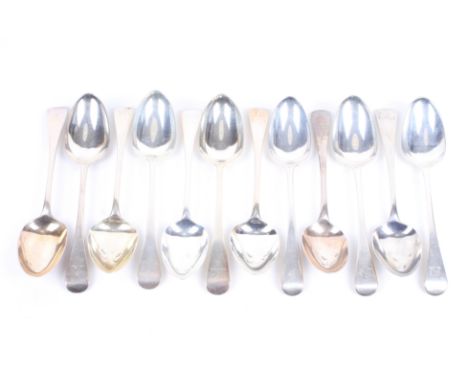 Twelve George III and later silver old English pattern table spoons. Each engraved with either single crest of a lion's head 