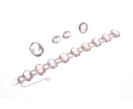 A vintage shell cameo suite of jewellery. Each set with an oval shell cameo depicting an unknown female profile, comprising; 