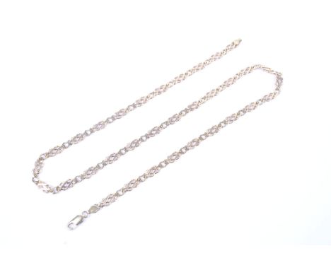A vintage 9ct gold fancy-entwined figure-of-eight link necklace. On a lobster-claw clasp, import hallmarks for London 1998, 6
