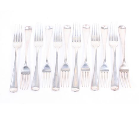 Twelve George III silver old English pattern table forks. Each engraved with a conforming crest, comprising, George Smith IV,