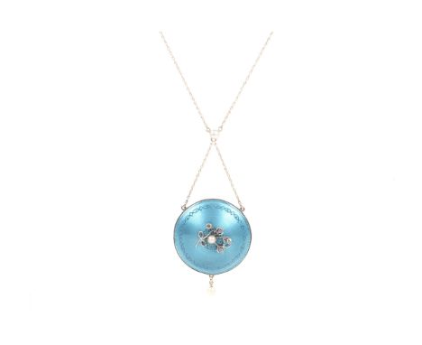 A Edwardian gold, seed pearl, diamond and turquoise enamel locket-back round pendant. The turquoise guilloche enamelled locke