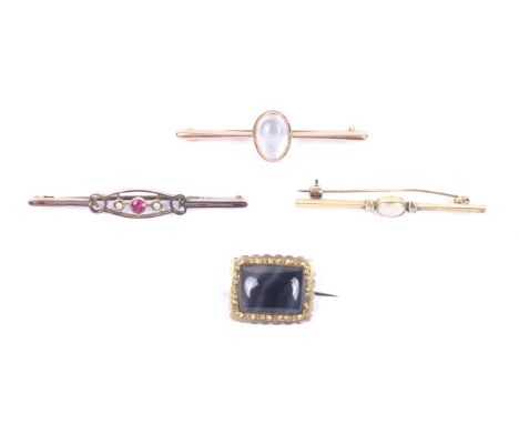 Four 19th century and later gem set brooches. Comprising; A 19th century gilt-metal and agate bolong brooch with a shaped bor