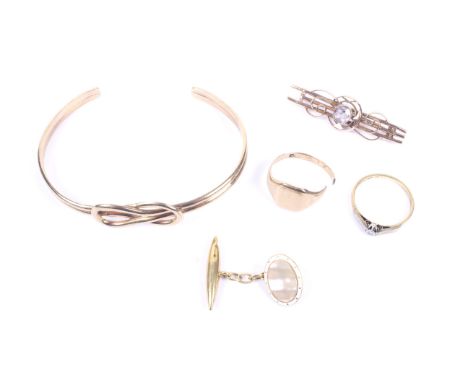 A small collection of gold jewellery including a vintage 9ct gold 'lover's knot' torque bangle. Hallmarks for London 1977, 11