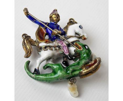 A 16th Century style gilded white metal &amp; coloured enamel pendant cast as St George on horseback slaying the dragon, susp