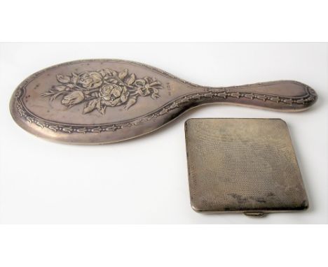 Silver engine turned cigarette case, Birmingham 1933; together with an Edwardian foliate embossed hand mirror, weight of ciga